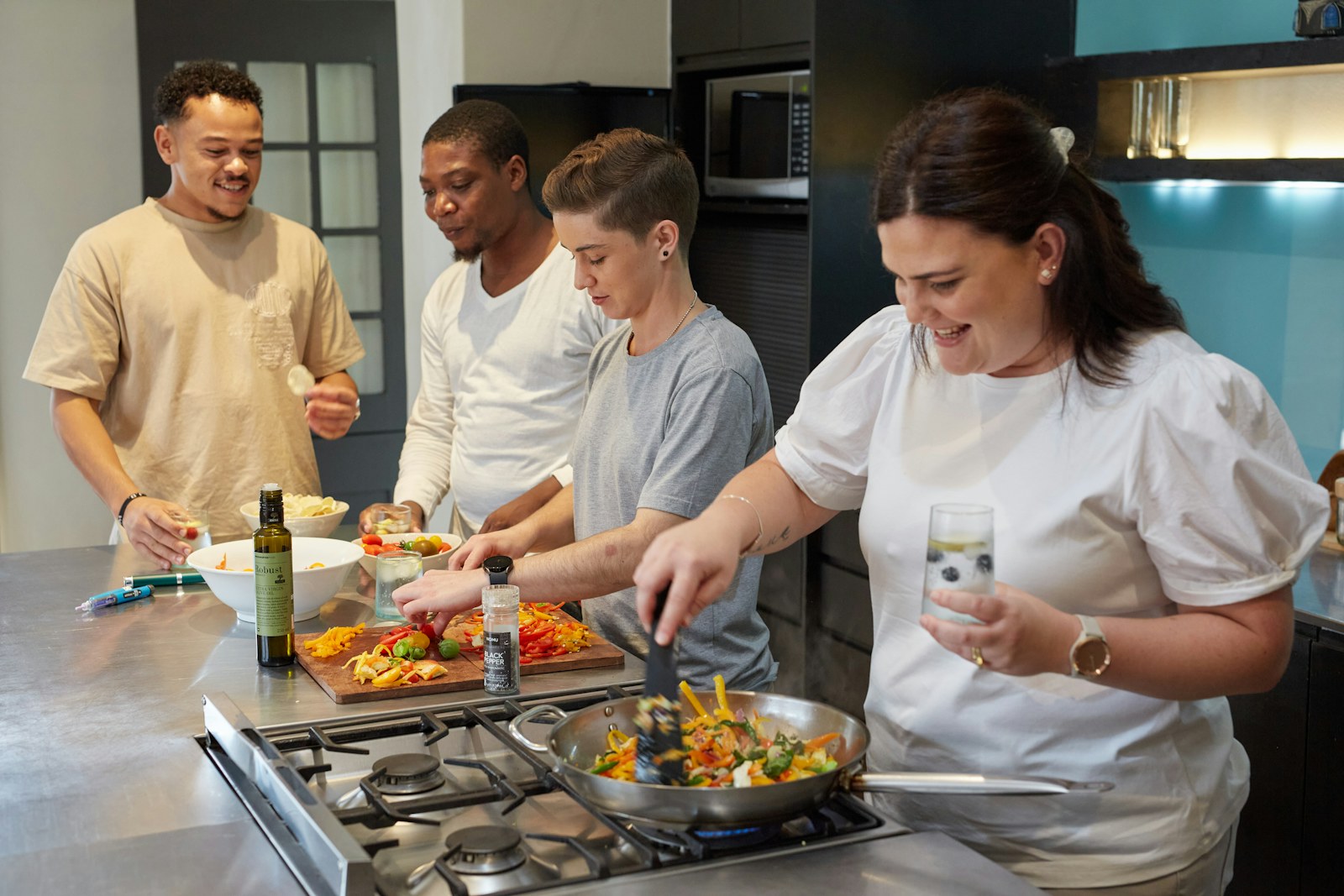 Community volunteers preparing hot meals in a warm kitchen