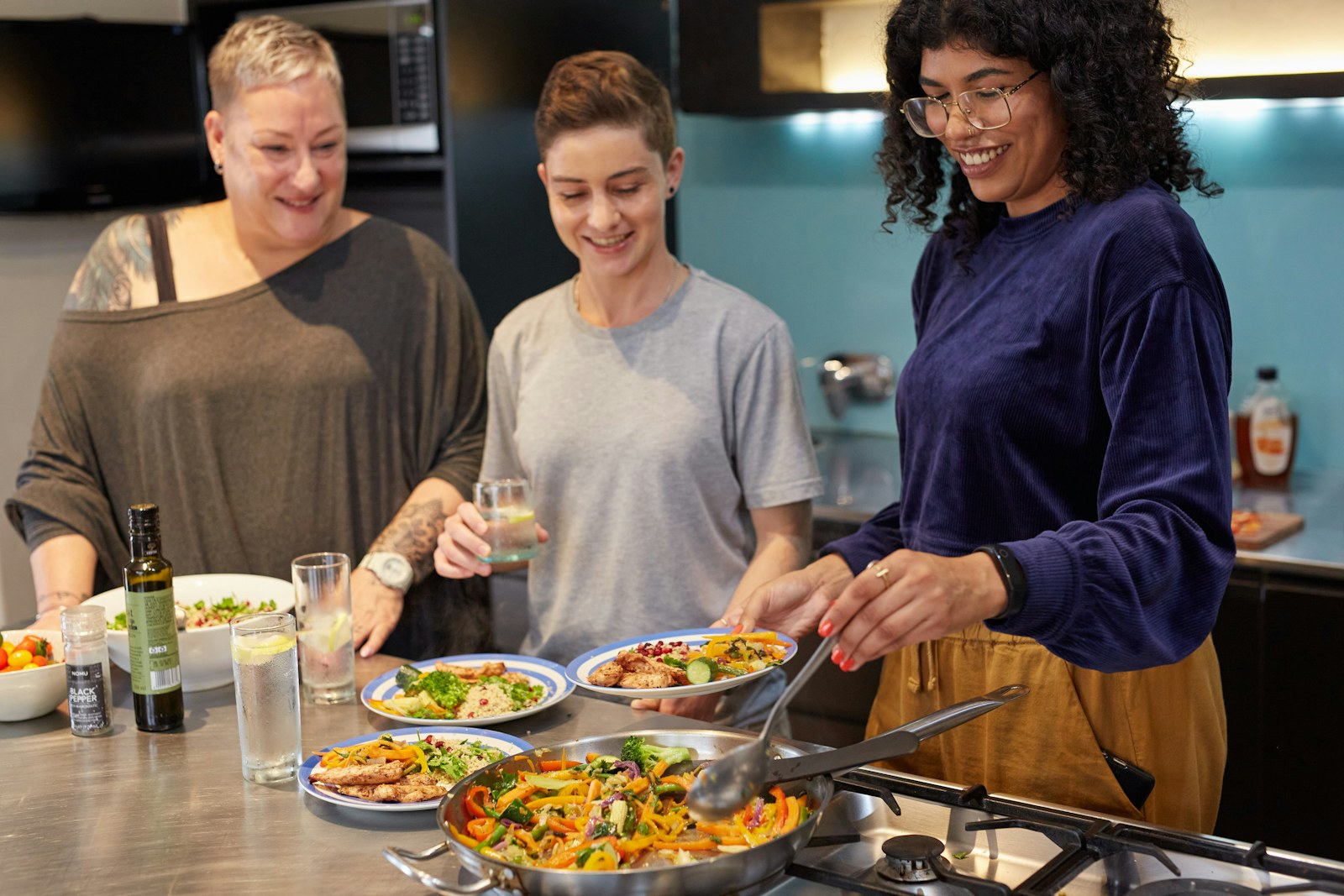 Volunteers preparing meals in the Harvest House kitchen